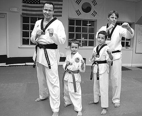 Black belt Ambassador Žygimantas Pavilionis with his sons Vincentas, Simonas, and Dominykas.
