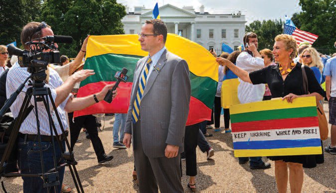 Ambassador Žygimantas Pavilionis demonstrating for Ukraine.
