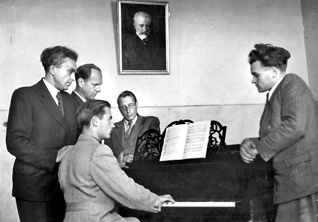 Around the piano at the Lithuanian Academy of Music and Theatre. Juozas Gruodis is far right.