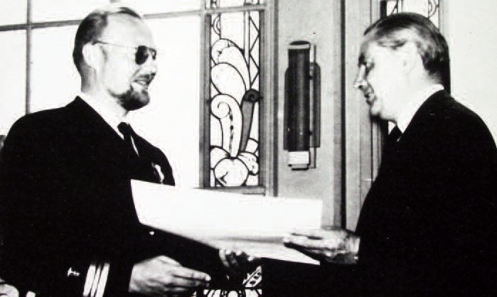 Honored for stopping epidemics in South America. Bolivian Defense Minister A. Crespo (r.) presents Dr. F. A. Bendoraitis with the Naval Merit Medal and a Lt. Commander’s commission in Bolivia’s Riverine Navy’s Medical Corps. (Bolivia is landlocked.) Dr. Bendoraitis also received an honorary Bolivian citizenship in 1967